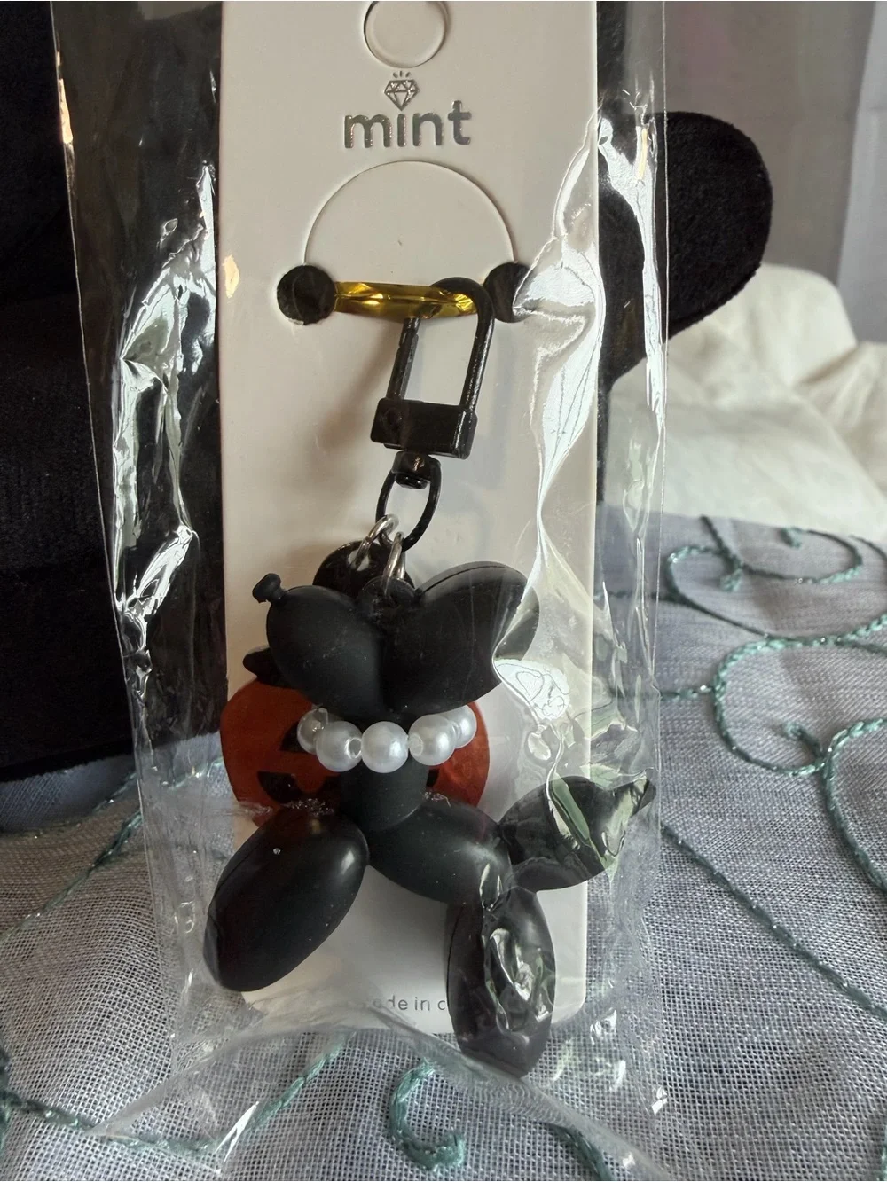 Mint Black Balloon Dog Keychain with Pearl Collar and Orange Pumpkin Charm